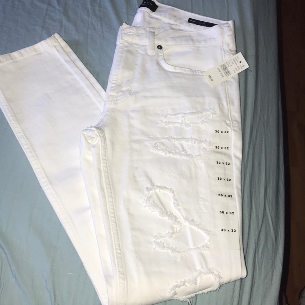 White ripped denim jeans